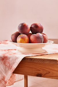 Plate with ripe peaches
