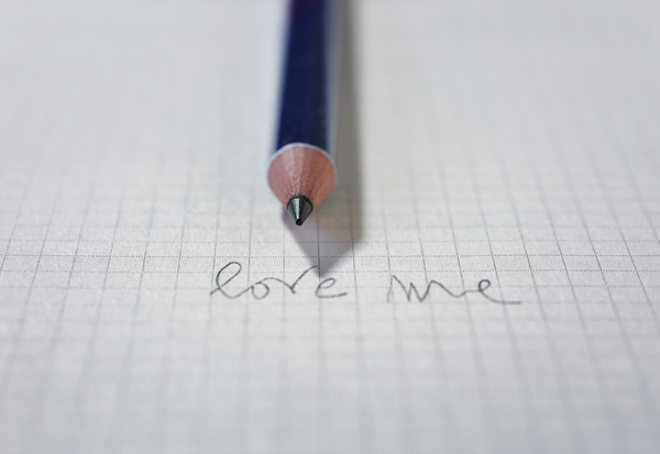Words LOVE ME on paper and pencil Print
