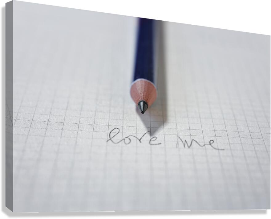 Words LOVE ME on paper and pencil Canvas Print
