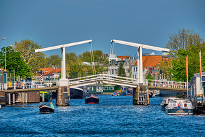 Boat passing under Gravestenenbrug bridge in Haarlem Netherland