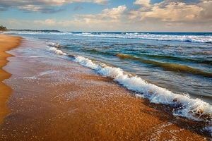 Wave surging on sand