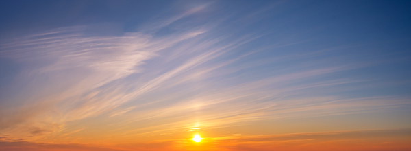 Dramatic sunset sky with vibrant colors and soft clouds over the horizon by Dmitry Rukhlenko