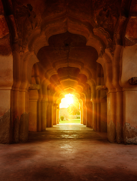Old ruined arch in ancient palace at sunset by Dmitry Rukhlenko