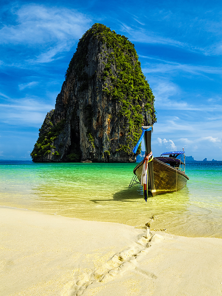 Long tail boat on beach Thailand by Dmitry Rukhlenko