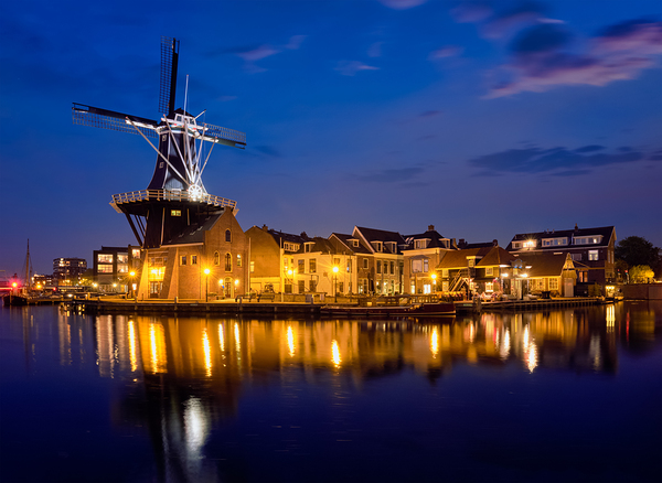 Harlem landmark windmill De Adriaan on Spaarne river. Harlem Netherlands by Dmitry Rukhlenko