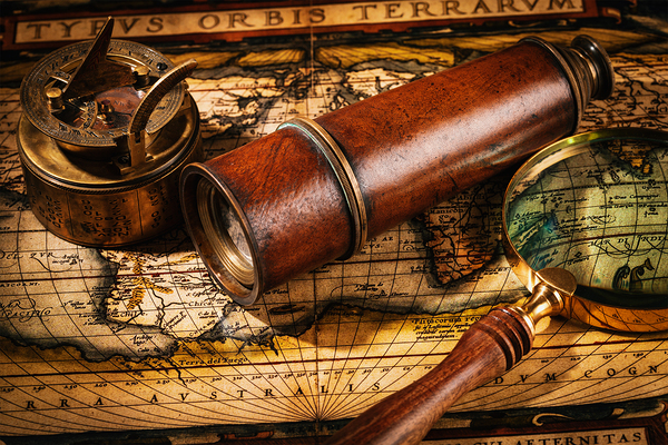 Old vintage compass on ancient map by Dmitry Rukhlenko