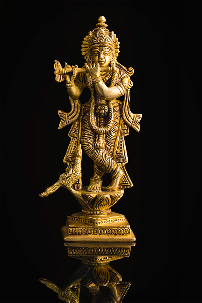 Krishna statue on white by Dmitry Rukhlenko