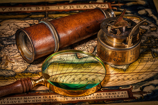 Old vintage compass on ancient map by Dmitry Rukhlenko