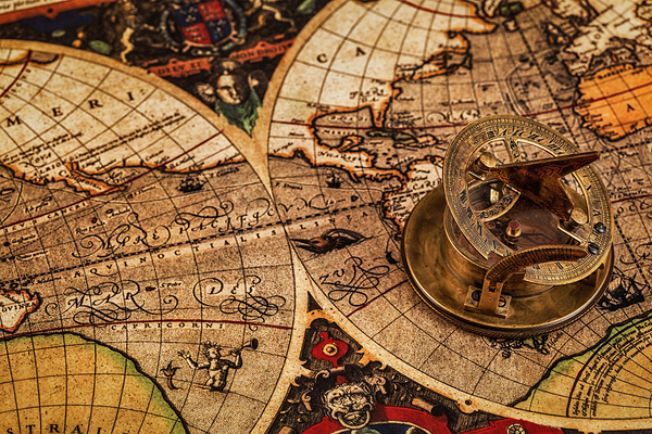 Old vintage compass on ancient map by Dmitry Rukhlenko