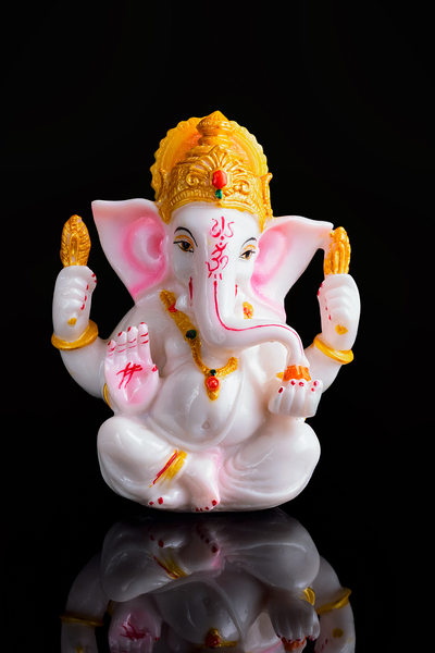 Ganesha statue on white by Dmitry Rukhlenko