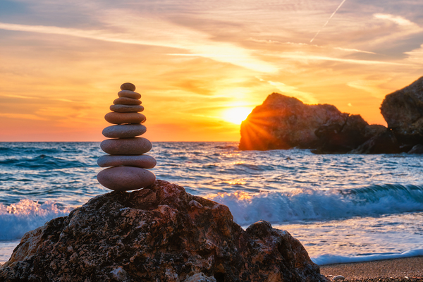 Concept of balance and harmony   stone stack on the beach by Dmitry Rukhlenko