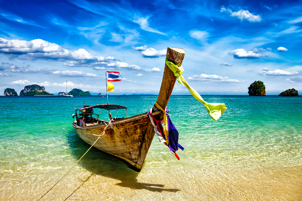 Long tail boat on beach Thailand by Dmitry Rukhlenko