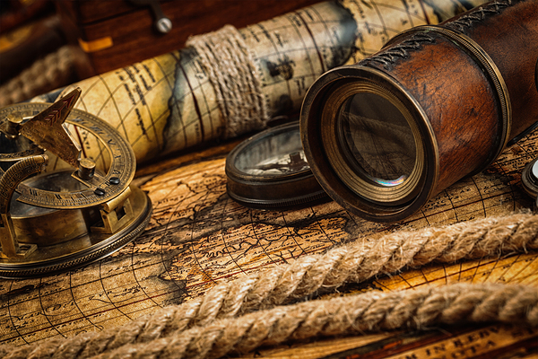 Old vintage compass on ancient map by Dmitry Rukhlenko