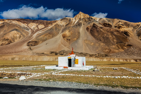 Small Hindu temple in Sarchu on Manali Leh road to Ladakh India by Dmitry Rukhlenko