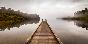 Tranquil Lake and Misty Dawn Panorama