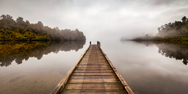 Tranquil Lake and Misty Dawn Panorama by Travelling Light