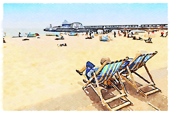 Couple sitting in deckchairs overlooking Bournemouth beach and pier Dorset England. by Travelling Light