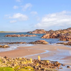 The beach at Fionnphort Mull Scotland with Iona in the background. Fionnphort is the ferry terminal for Iona.