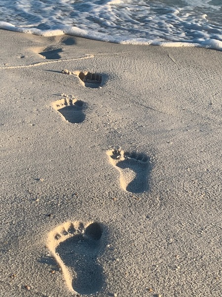 Footprints on the beach by Missouri Micky