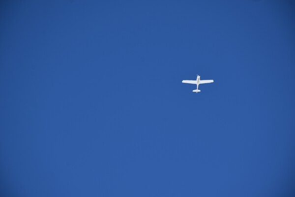 A plane in a blue sky by Laprise