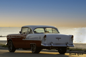 Red and White Classic Car on the Beach