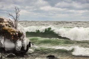 Waves of Lake Superior, ice and rocks along the shoreline; Thunder Bay, Ontario, Canada