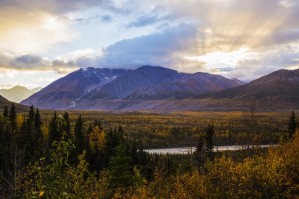 Autumn sunset overlooking the area known as 'Black Rapids' in the Alaska Range along the Richardson Highway; Alaska, United States of America