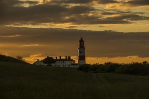 Souter Lighthouse under a glowing golden sky at sunset; South Shields, Tyne and Wear, England