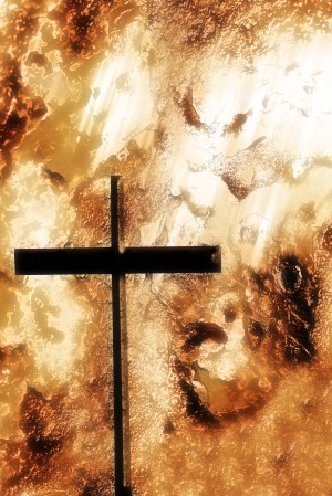 A Cross With An Orange Rough Background