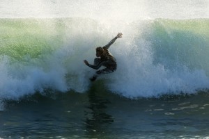 Surfer Catching A Wave