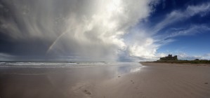 Clouds Reflected In The Shallow Water On A Beach; Northumberland, England