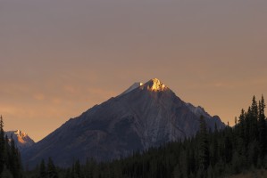 Sunrise Lights Up A Mountain Peak; Alberta, Canada