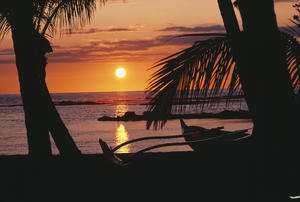 Hawaii, Big Island, Mauna Lani Beach Hotel, Ocean Sunset, Outrigger Canoe Resting On A Tropical Beach.