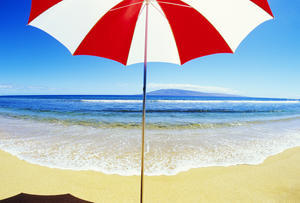 Red And White Umbrella On The Beach, Blue Sky And Ocean