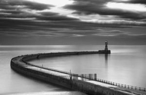 A curving pier with a lighthouse at the end;Sunderland tyne and wear england
