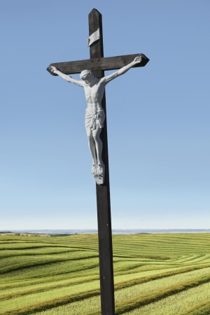 A crucifix on farmland;Saskatchewan canada
