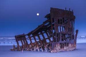 The moon sets over the wreck of the Peter Iredale; Oregon, United States of America