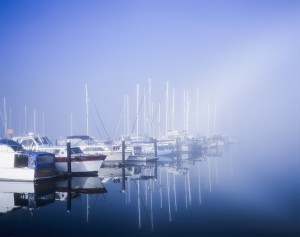 Docked boats on a foggy morning, Winchester Bay; Oregon, United States of America