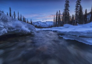Motion blur of Wheaton River in winter; Yukon, Canada
