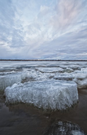 Long exposure of the ice flowing down the Porcupine River after it broke up; Old crow, Yukon, Canada