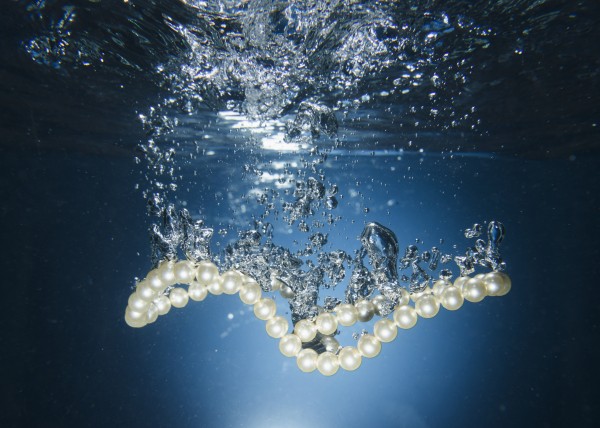 Pearl necklace underwater; Tarifa, Cadiz, Andalusia, Spain by PacificStock