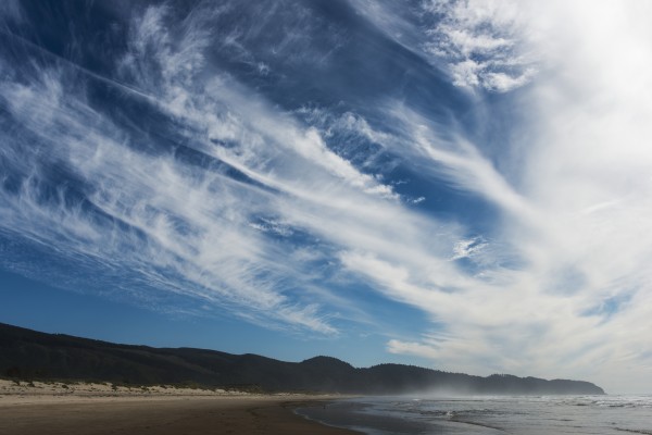 Clouds drift past Cape Lookout on the Oregon Coast; Netarts, Oregon, United States of America by PacificStock