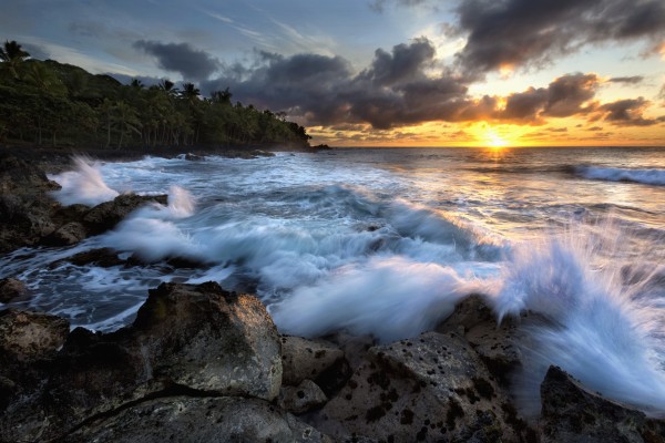 Sunrise over the ocean and a view of the coastline; Opihikao, Island of Hawaii, Hawaii, United States of America by PacificStock