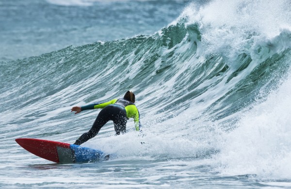 Surfer catching a wave; Tarifa, Cadiz, Andalusia, Spain by PacificStock