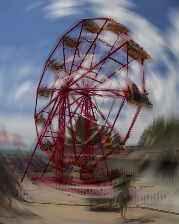 Ferris wheel at amusement park, motion blur;   Calgary, Alberta, Canada by PacificStock