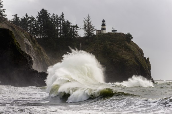 Surf breaks at Cape Disappointment Lighthouse; Ilwaco, Washington, United States of America by PacificStock