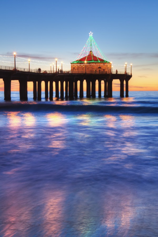 Manhattan Beach Pier at sunset, completed in 1920, Roundhouse Marine Studies Lab and Aquarium (octagonal building, end of pier); Manhattan Beach, California, United States of America by PacificStock