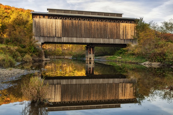 Fisher covered railroad bridge over Lamoille River in autumn; Wolcott, Vermont, United States of America by PacificStock