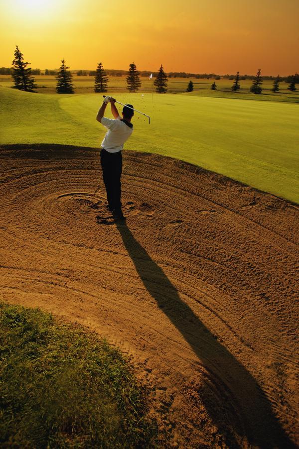 Golfer Taking A Swing From A Golf Bunker Print