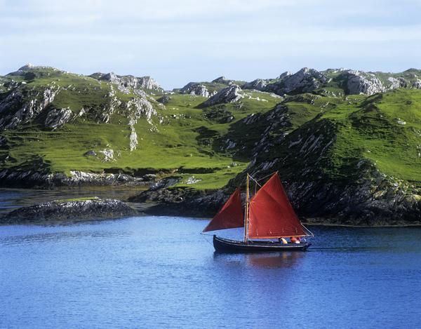 Boat In The Sea, Galway Hooker, County Galway, Republic Of Ireland by PacificStock
